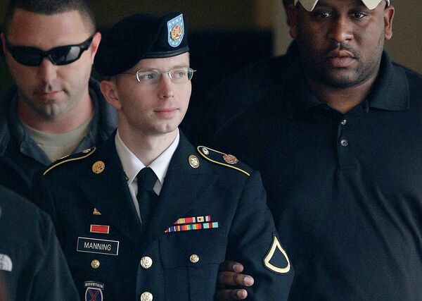Army Pfc. Bradley Manning (now Chelsea Manning) is escorted to a security vehicle outside a courthouse in Fort Meade, Md., after a hearing in his court martial. Army Pfc. Bradley Manning (now Chelsea Manning) is escorted to a security vehicle outside a courthouse in Fort Meade, Md., after a hearing in his court martial. - Sputnik International