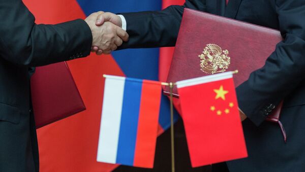 Russian and Chinese officials signed a major memorandum of understanding in March 2014 that laid the groundwork for future energy cooperation - Sputnik International