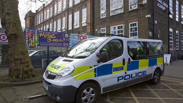 A police vehicle is pictured outside Bethnal Green Academy, where three missing British school girls attend, in east London, on February 23, 2015 - Sputnik International