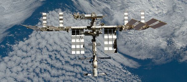 The International Space Station is featured in this image photographed by an STS-133 crew member on space shuttle Discovery after the station and shuttle began their post-undocking relative separation. Undocking of the two spacecraft occurred at 7 a.m. (EST) on March 7, 2011. - Sputnik International