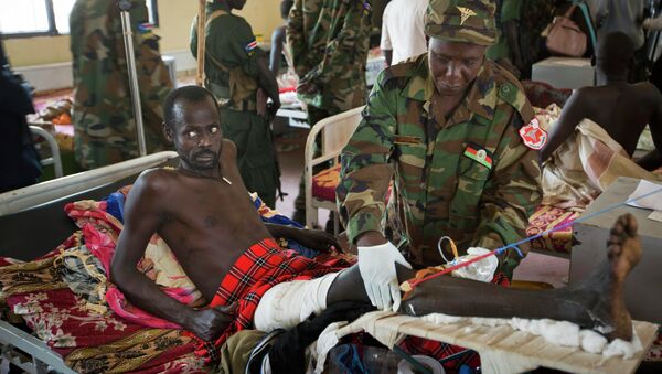 In this December 2013 file photo, a patient is treated by a military doctor in a ward at the Juba Military Hospital in Juba, South Sudan. - Sputnik International