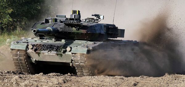 A Leopard 2 tank is pictured during a demonstration event held for the media by the German Bundeswehr in Munster near Hannover, Germany. (File) A Leopard 2 tank is pictured during a demonstration event held for the media by the German Bundeswehr in Munster near Hannover, Germany. (File) - Sputnik International