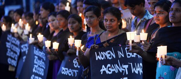 Women hold placards during a silent protest titled Women in Black for Peace on the eve of International Women's Day in Bangalore Women hold placards during a silent protest titled Women in Black for Peace on the eve of International Women's Day in Bangalore - Sputnik International