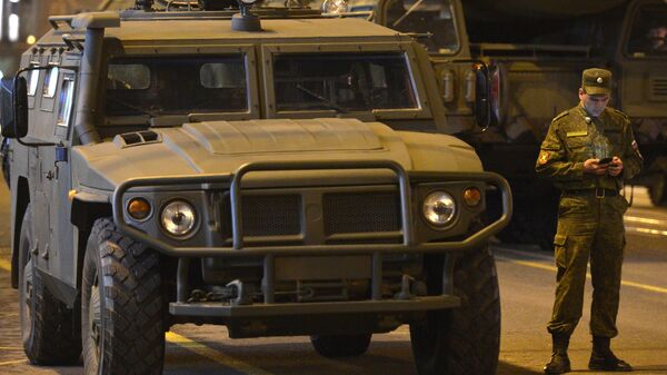 A soldier at a GAZ-2330 Tigr armored vehicle during a Victory Day Parade rehearsal - Sputnik International