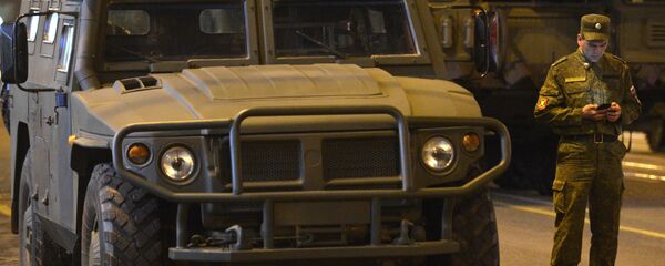 A soldier at a GAZ-2330 Tigr armored vehicle during a Victory Day Parade rehearsal - Sputnik International
