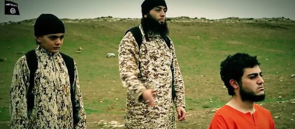 A new video posted online Tuesday by the Islamic State purports to show a young child carrying out the execution of Muhammad Musallam, and Israeli Arab who IS has claimed was a Mossad spy. - Sputnik International