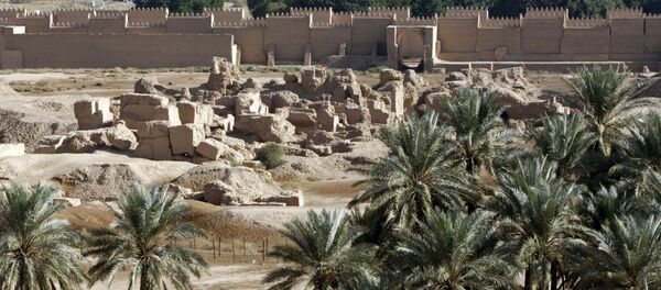 A view of the newly constructed (back) and ruins (foreground) of the ancient city of Babylon, some 100 kms south of Baghdad, on November 27, 2008 A view of the newly constructed (back) and ruins (foreground) of the ancient city of Babylon, some 100 kms south of Baghdad, on November 27, 2008 - Sputnik International