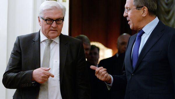 Russian Foreign Minister Sergei Lavrov (R) speaks with his German counterpart Frank-Walter Steinmeier - Sputnik International