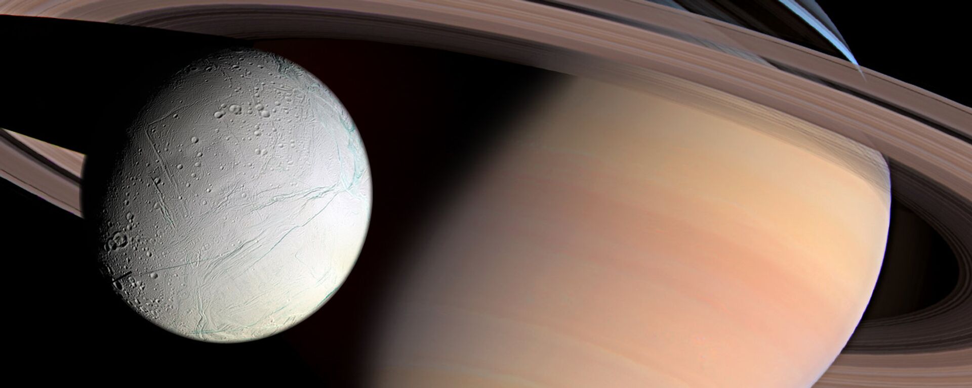 Saturn and Enceladus  - Sputnik International, 1920, 03.10.2019