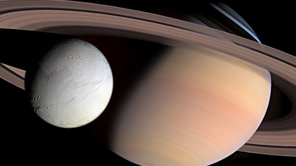 Saturn and Enceladus - Sputnik International