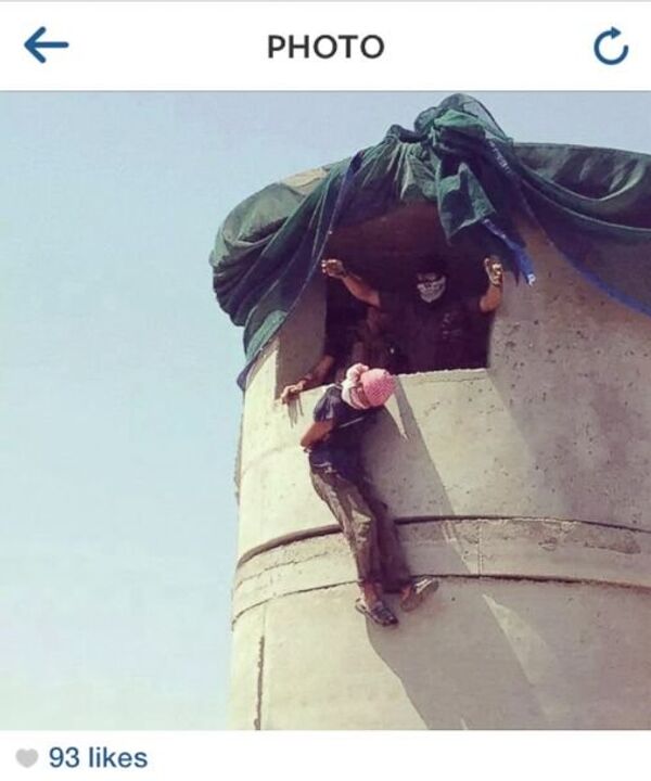 A detainee appears to be dropped or hung by the neck from what looks like a military base guard tower. A detainee appears to be dropped or hung by the neck from what looks like a military base guard tower. - Sputnik International