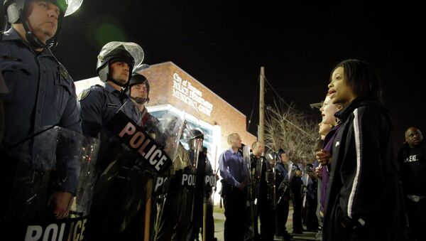 Police and protesters square off outside the Ferguson Police Department, Wednesday, March 11, 2015, in Ferguson, Mo - Sputnik International