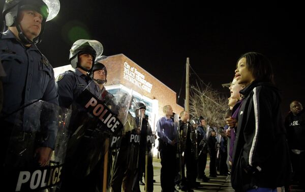 Police and protesters square off outside the Ferguson Police Department, Wednesday, March 11, 2015, in Ferguson, Mo - Sputnik International