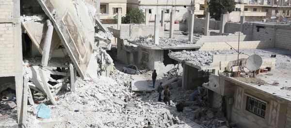 Men walk amidst the rubble of damaged buildings at a site hit on Tuesday by what activists said were airstrikes by forces loyal to Syria's President Bashar al-Assad in the rebel-controlled area of Deir al-Asafir town, near Damascus March 11, 2015 Men walk amidst the rubble of damaged buildings at a site hit on Tuesday by what activists said were airstrikes by forces loyal to Syria's President Bashar al-Assad in the rebel-controlled area of Deir al-Asafir town, near Damascus March 11, 2015 - Sputnik International