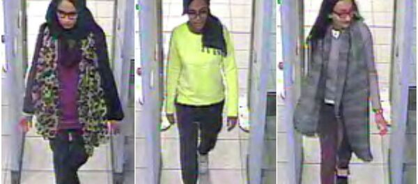 British teenage girls Shamima Begun, Amira Abase and Kadiza Sultana (L-R) walk through security at Gatwick airport before they boarded a flight to Turkey on February 17, 2015 British teenage girls Shamima Begun, Amira Abase and Kadiza Sultana (L-R) walk through security at Gatwick airport before they boarded a flight to Turkey on February 17, 2015 - Sputnik International