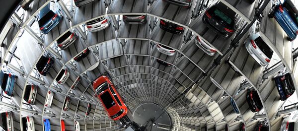 A VW Golf is pictured inside the so-called cat towers of car manufacturer Volkswagen AG (VW) at the company's assembly plant in Wolfsburg, northern Germany A VW Golf is pictured inside the so-called cat towers of car manufacturer Volkswagen AG (VW) at the company's assembly plant in Wolfsburg, northern Germany - Sputnik International