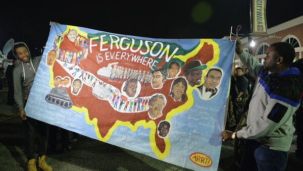 Protestors demonstrate outside the Ferguson Police Department in Ferguson, Missouri on March 12, 2015 - Sputnik International