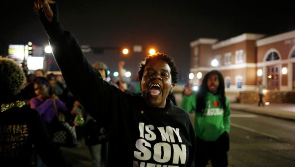 A protestor shouts during a demonstration outside the Ferguson Police Department in Ferguson, Missouri, March 12, 2015 - Sputnik International