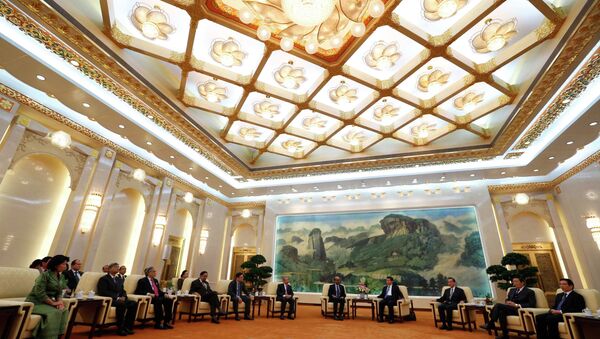 China's President Xi Jinping (4th R) meets with the guests at the Asian Infrastructure Investment Bank (AIIB) launch ceremony at the Great Hall of the People in Beijing in this October 24, 2014 - Sputnik International