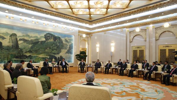 Chinese President Xi Jinping meets with guests of the Asian Infrastructure Investment Bank at the Great Hall of the People in Beijing on October 24, 2014 - Sputnik International