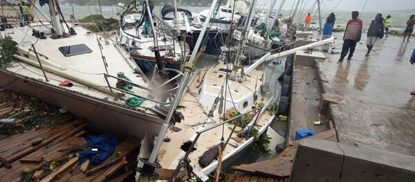 Local residents look at damaged boats against a jetty in Port Vila, the capital city of the Pacific island nation of Vanuatu March 14, 2015 Local residents look at damaged boats against a jetty in Port Vila, the capital city of the Pacific island nation of Vanuatu March 14, 2015 - Sputnik International