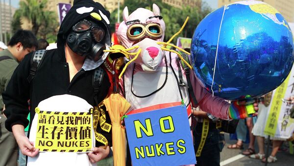 Demonstrators wearing costumes take part in an anti-nuclear protest in Taipei March 14, 2015 - Sputnik International