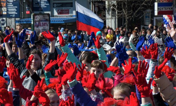 Participants of the Crimean Spring anniversary celebrations march in downtown Simferopol - Sputnik International