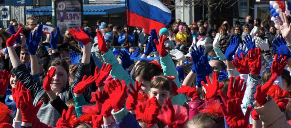Participants of the Crimean Spring anniversary celebrations march in downtown Simferopol Participants of the Crimean Spring anniversary celebrations march in downtown Simferopol - Sputnik International