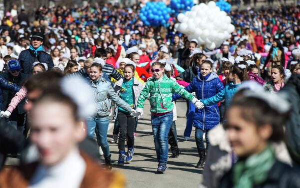 Participants of the Crimean Spring anniversary celebrations march in downtown Simferopol - Sputnik International
