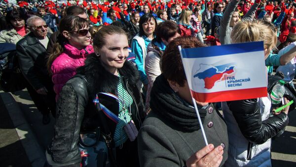 Participants of the Crimean Spring anniversary celebrations march in downtown Simferopol - Sputnik International