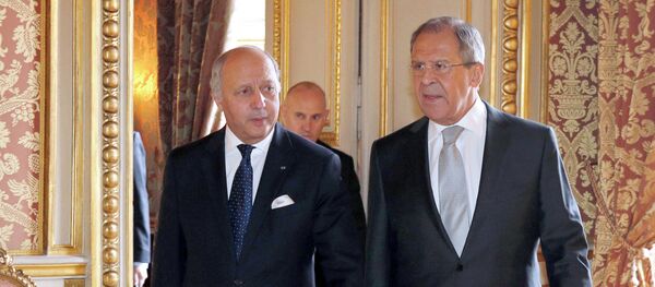 French Foreign Affairs Minister Laurent Fabius, left, walks with his Russian counterpart Sergei Lavrov at the French Foreign Affairs Ministry before a meeting in Paris. - Sputnik International