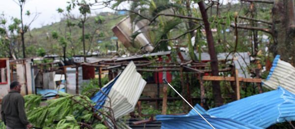 Debris is scattered over a building in Port Vila, Vanuatu, Saturday, March 14, 2015, in the aftermath of Cyclone Pam Debris is scattered over a building in Port Vila, Vanuatu, Saturday, March 14, 2015, in the aftermath of Cyclone Pam - Sputnik International