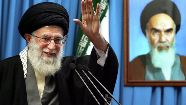 Iranian supreme leader Ayatollah Ali Khamenei waves to the worshippers. - Sputnik International