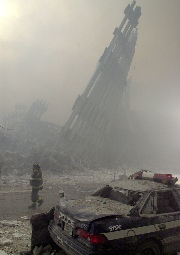 Destroyed mullions, the vertical struts which once faced the soaring outer walls of the World Trade Center towers, are the only thing left standing behind a lone fireman, after a terrorist attack on the twin towers of lower Manhattan Tuesday, Sept. 11, 2001. - Sputnik International