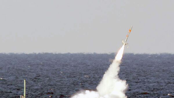 A Tomahawk cruise missile is seen emerging from the ocean after being launched from the USS Florida. - Sputnik International