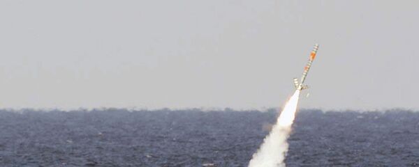 A Tomahawk cruise missile is seen emerging from the ocean after being launched from the USS Florida. - Sputnik International