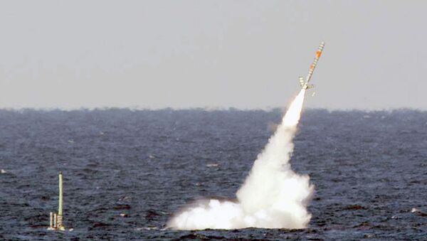 A Tomahawk cruise missile is seen emerging from the ocean after being launched from the USS Florida. - Sputnik International