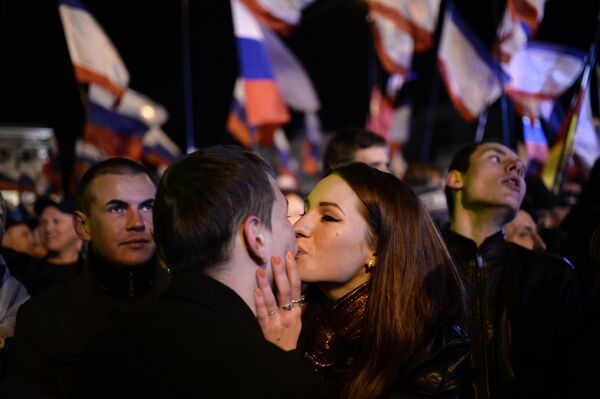 A file picture taken on March 16, 2014 shows a Crimean couple kissing as people celebrate in Simferopol's Lenin Square after exit polls showed that about 93 percent of voters in Ukraine's Crimea region supported union with Russia. A file picture taken on March 16, 2014 shows a Crimean couple kissing as people celebrate in Simferopol's Lenin Square after exit polls showed that about 93 percent of voters in Ukraine's Crimea region supported union with Russia. - Sputnik International