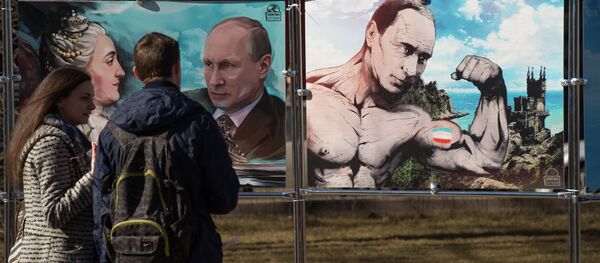 A couple stands by pictures depicting Russia's President Vladimir Putin at an open-air political cartoons exhibition dedicated to the one-year anniversary of Crimea voting to leave Ukraine and join the Russian state in central Moscow on March 16, 2015. A couple stands by pictures depicting Russia's President Vladimir Putin at an open-air political cartoons exhibition dedicated to the one-year anniversary of Crimea voting to leave Ukraine and join the Russian state in central Moscow on March 16, 2015. - Sputnik International