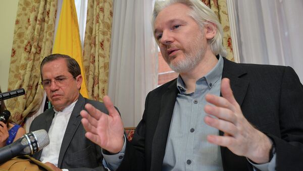 Julian Assange, with Ecuadorian Foreign Minister Ricardo Patiño, said in an Aug. 8 2014 press conference that he would be leaving the embassy soon, though denied he was going to hand himself over to British police. - Sputnik International