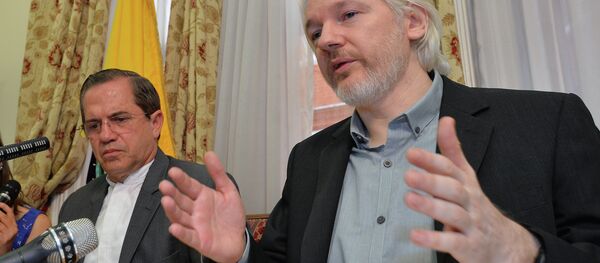 Julian Assange, with Ecuadorian Foreign Minister Ricardo Patiño, said in an Aug. 8 2014 press conference that he would be leaving the embassy soon, though denied he was going to hand himself over to British police. Julian Assange, with Ecuadorian Foreign Minister Ricardo Patiño, said in an Aug. 8 2014 press conference that he would be leaving the embassy soon, though denied he was going to hand himself over to British police. - Sputnik International
