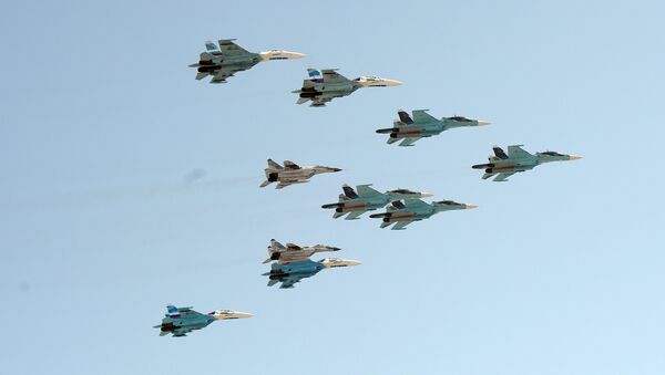 A group of 10 aircraft: Sukhoi 34 aircraft, Sukhoi 27 aircraft and MiG 29 aircraft - Sputnik International