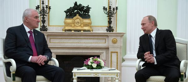 Russian President Vladimir Putin, right, and South Ossetian President Leonid Tibilov meet in the Kremlin Russian President Vladimir Putin, right, and South Ossetian President Leonid Tibilov meet in the Kremlin - Sputnik International