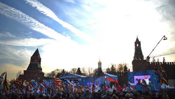 Rally and concert on Vasilyevsky Slope to mark anniversary of Crimea's reunification with Russia - Sputnik International