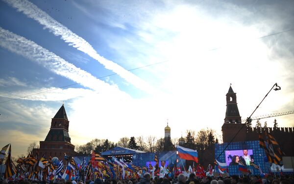 Rally and concert on Vasilyevsky Slope to mark anniversary of Crimea's reunification with Russia. - Sputnik International