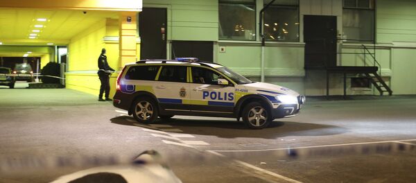 A police officer stands at the scene of a fatal shooting in Gothenburg A police officer stands at the scene of a fatal shooting in Gothenburg - Sputnik International