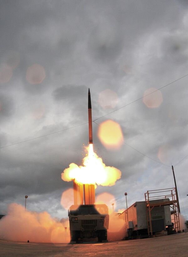  Lockheed Martin shows the Terminal High Altitude Area Defense system, or THAAD missile being launched from a mobile launcher at Kauai's Pacific Missile Range Facility - Sputnik International