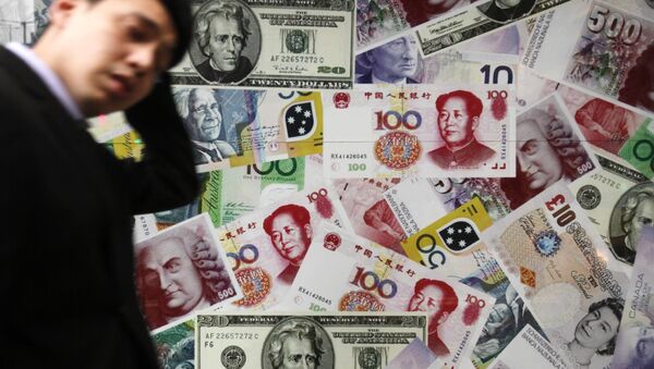 A man walks past a collage of copies of Chinese RMB, U.S. dollar and other foreign bills at a money exchange store in Hong Kong Thursday, April 15, 2010 - Sputnik International