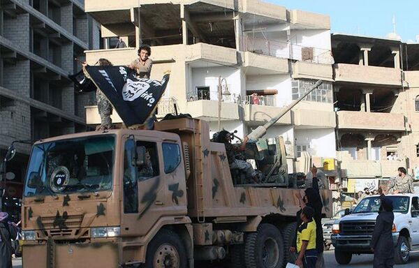 Fighters from the al-Qaida linked Islamic State of Iraq and the Levant (ISIL) during a parade in Raqqa, Syria Fighters from the al-Qaida linked Islamic State of Iraq and the Levant (ISIL) during a parade in Raqqa, Syria - Sputnik International