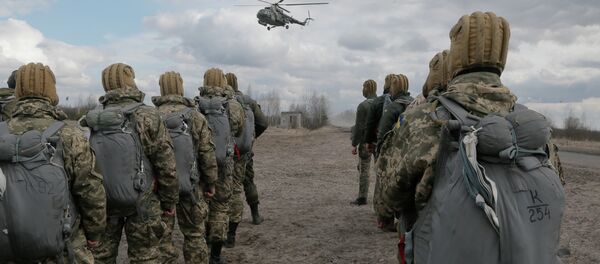 Ukrainian army soldiers perform a military exercise at a training ground outside Zhitomir, Ukraine Ukrainian army soldiers perform a military exercise at a training ground outside Zhitomir, Ukraine - Sputnik International